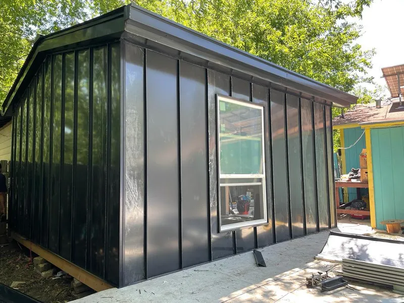 Black standing seam metal wall panels for Roof Inspection in North Riverside