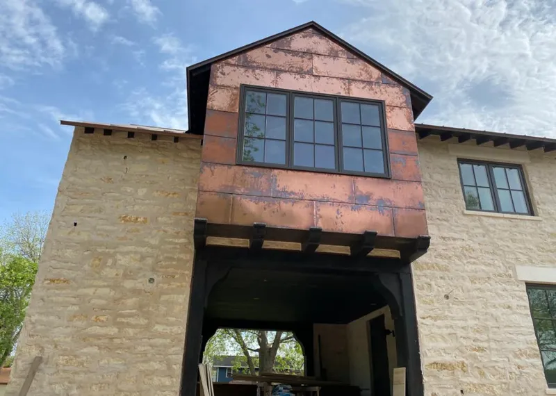 Copper metal panel facade on a stone building for Metal Roof Coating in North Riverside
